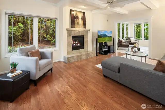 The family room offers a cozy retreat with a warm fireplace and inviting ambiance.