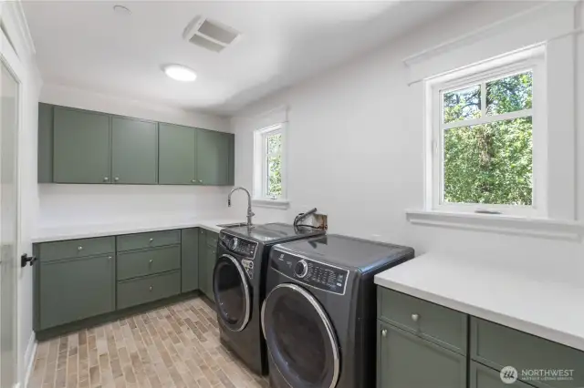 Large Laundry Room with Ample Cabinetry and counter top space