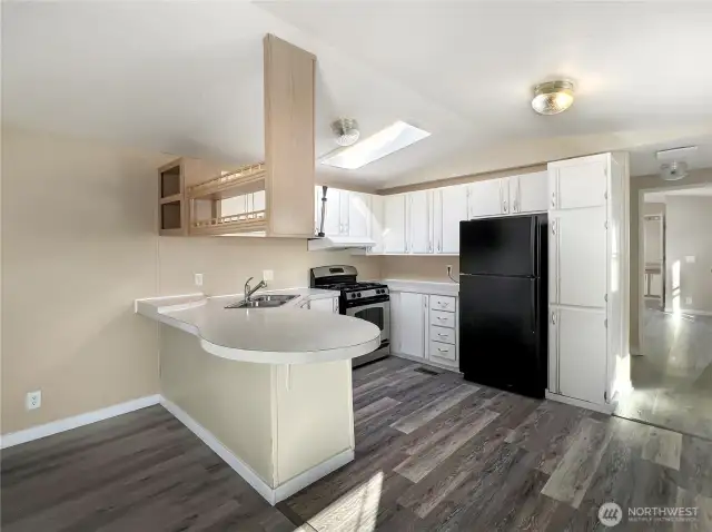 The kitchen includes a breakfast bar, making it ideal for entertaining.