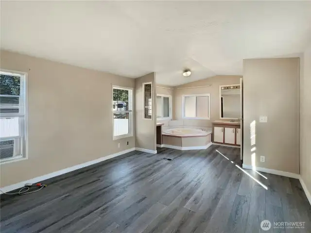 Spacious primary bedroom with full bath.