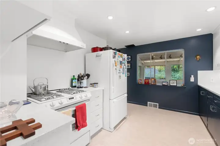 New quartz counters and backsplash. Gas cooking