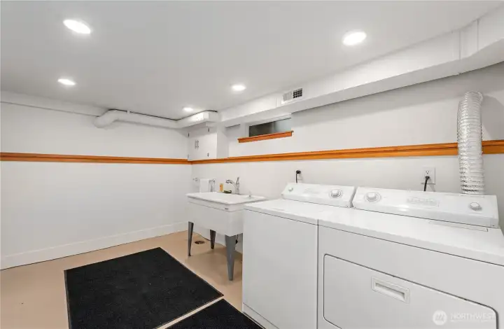 Laundry area with repurposed fir shelving
