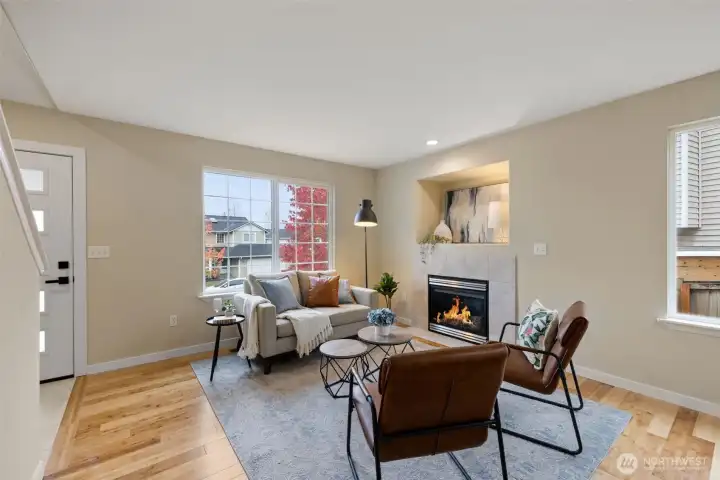 West facing living room with cozy gas fireplace.