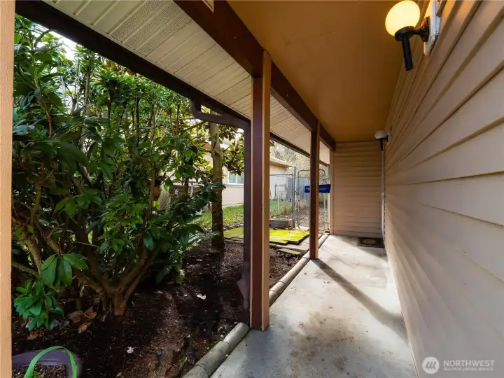 The covered entrance keeps you and your guest dry when the weather offers liquid sunshine.