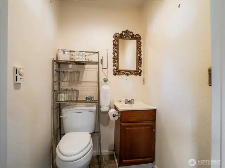 The half bath is located adjacent to the family room.