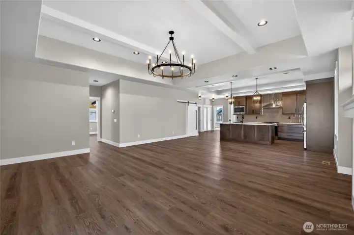 Open Layout with Trayed Ceilings and Faux Beams