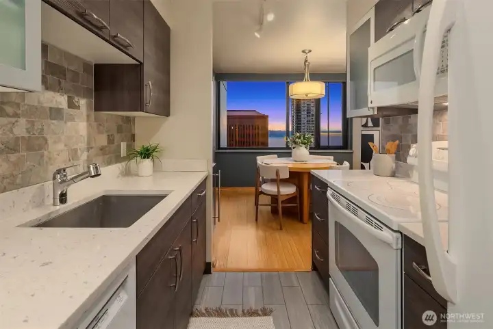 Private galley kitchen tucked away from main living area.
