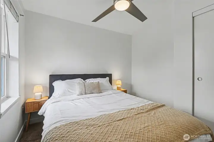 Front Bedroom - Staged with queen bed and and side tables and brand new ceiling-light fan