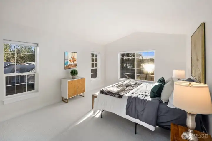 Spacious primary bedroom with Lake view