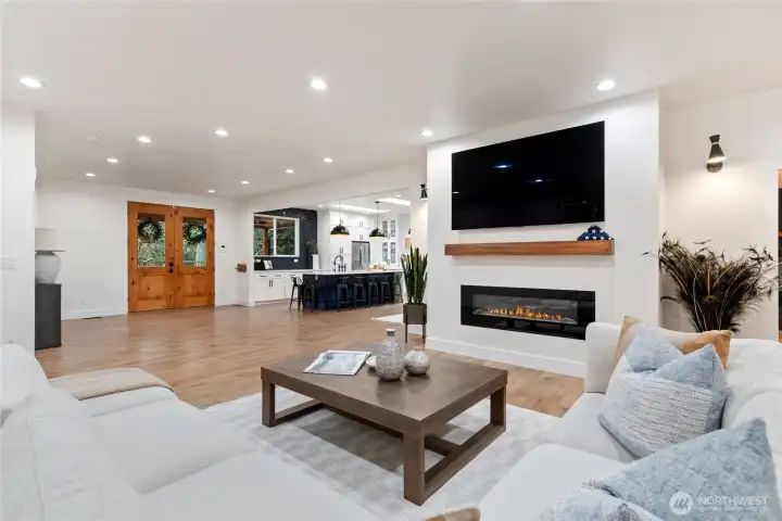 View of family room into entry way and kitchen