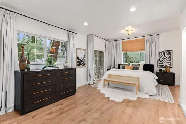 Primary suite on the main level very large and spacious with sliding door off to deck!