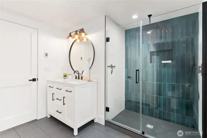Three quarter bath on main floor with varient heated flooring! Stunning finishes and tile shower surround!