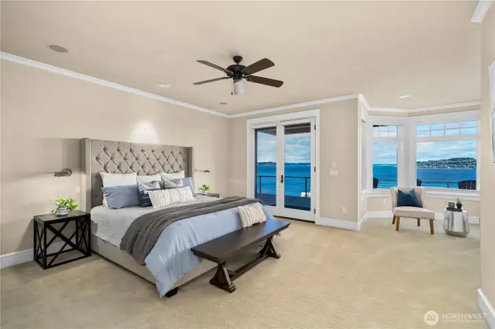Primary bedroom on the main floor with sitting area and private deck access