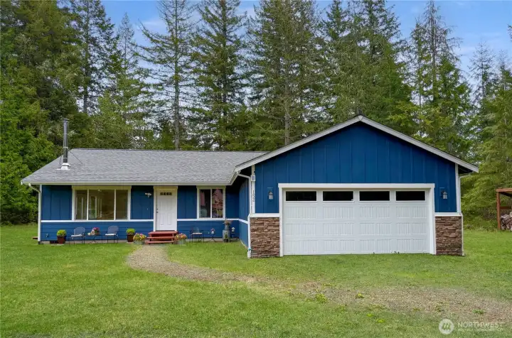A charming Northwest retreat tucked among the trees, offering the kind of privacy and quiet buyers dream about when they want space to breathe.