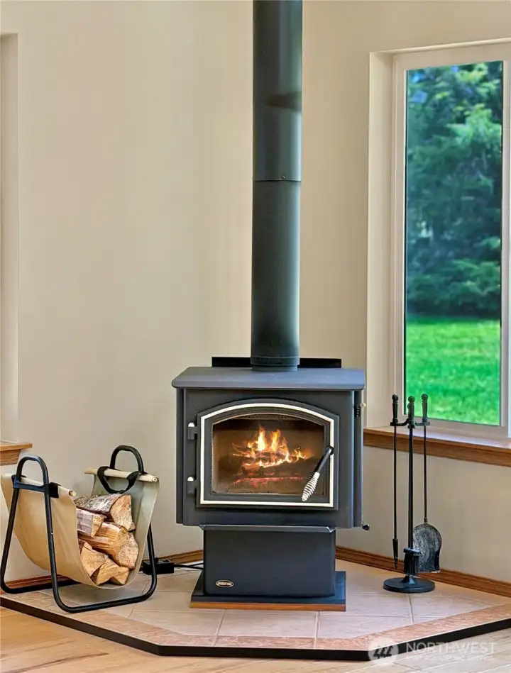 The wood stove adds instant character and comfort — the kind of cozy feature that makes rainy evenings, snowy mornings, and quiet nights feel extra special.