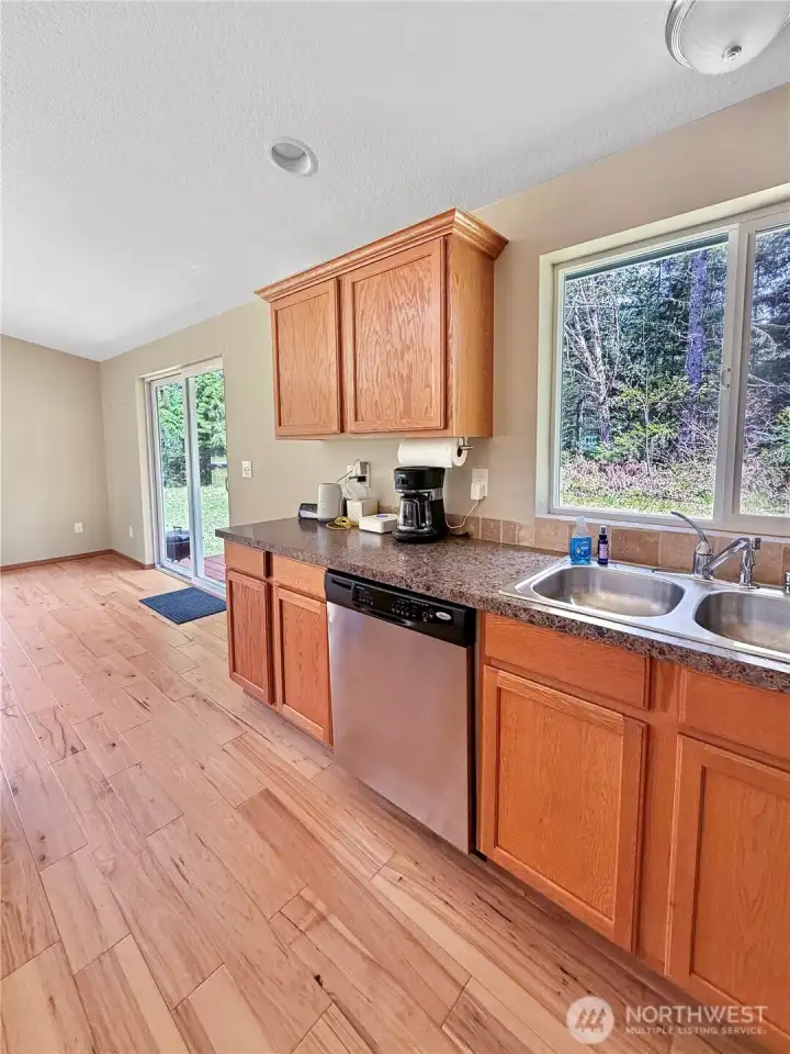 The open-concept layout keeps everyone connected, whether you’re cooking, entertaining, or relaxing by the fire after a day of adventure.