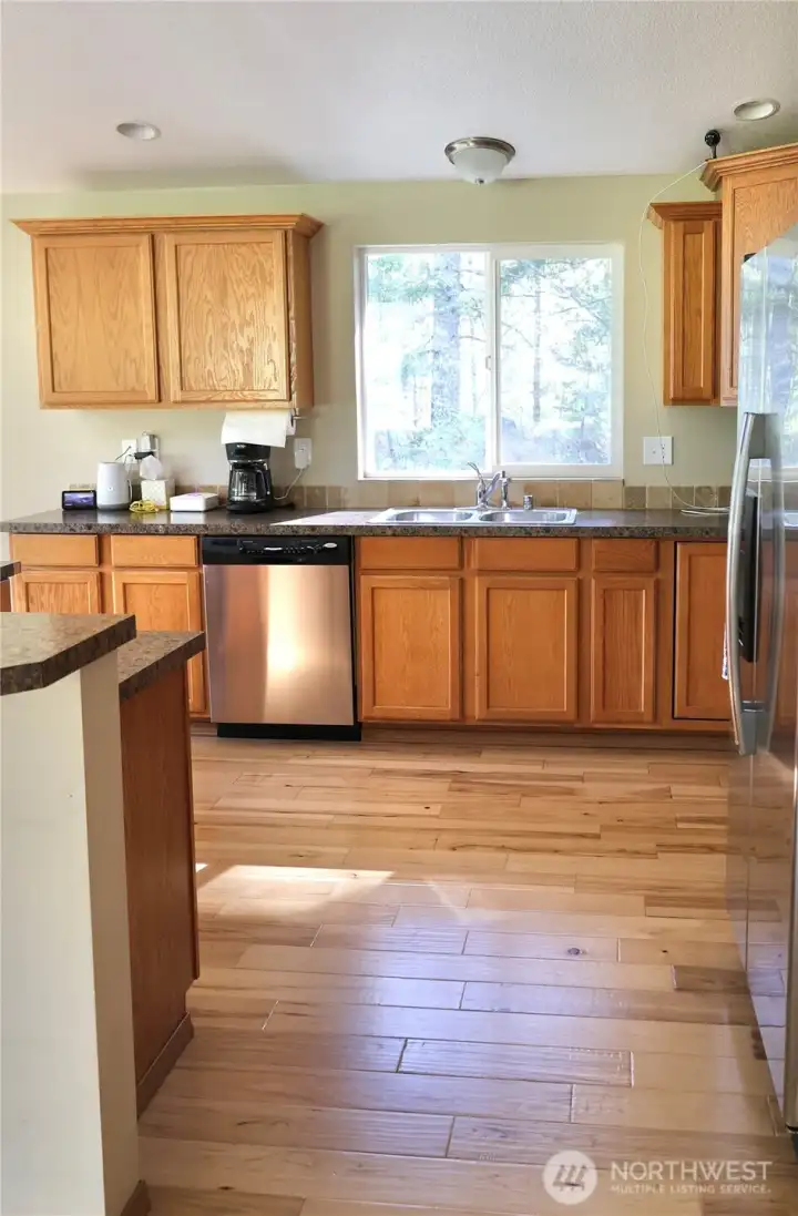 The open-concept layout keeps everyone connected, whether you’re cooking, entertaining, or relaxing by the fire after a day of adventure.