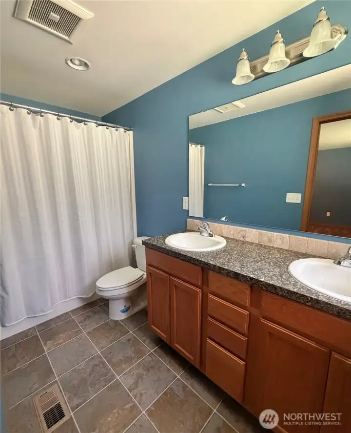 Primary bathroom, double sinks, tub and shower.