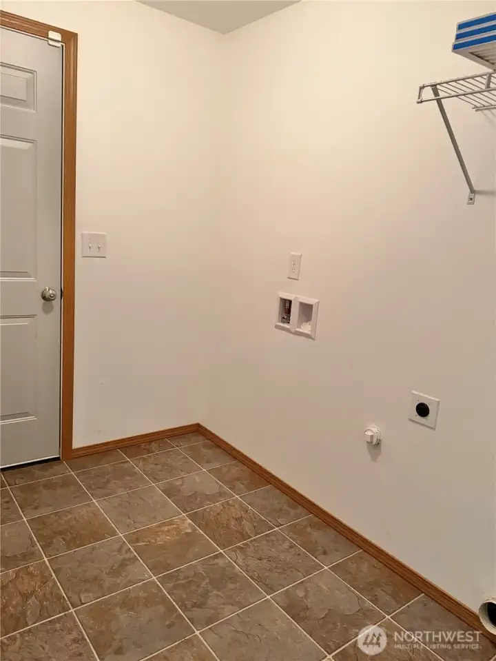 Utility-laundry room connecting to the attached 2-car garage.