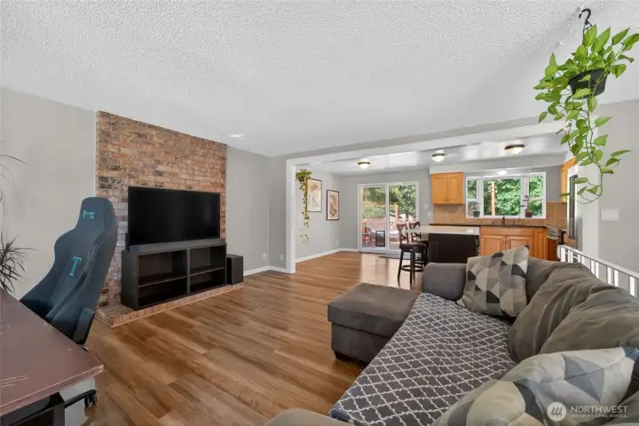 Dramatic floor-to-ceiling brick fireplace creates a stunning focal point. Dramatic floor-to-ceiling brick fireplace creates a stunning focal point.