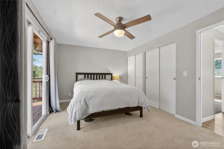 Spacious primary suite with peaceful backyard views. Spacious primary suite with peaceful backyard views.