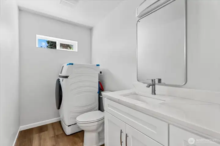 Half bath and laundry with premium heat pump washer/dryer combo Half bath and laundry with premium heat pump washer/dryer combo