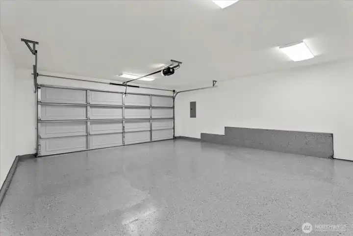 Finished garage with epoxy coated flooring Finished garage with epoxy coated flooring