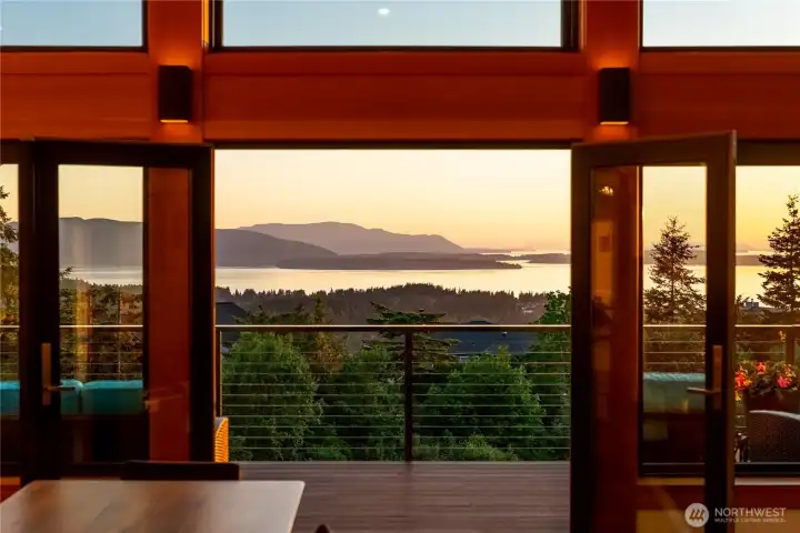 Double doors to the deck, perfect for entertaining or just relaxing and taking in the unobstructed water views.
