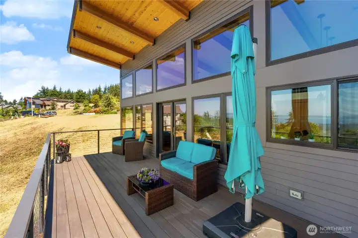 High end composite decking and aluminum railing, plus a generous covered area make this a deck you can enjoy year round
