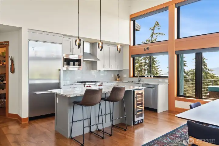 Miele built-in 36" refrigerator, Bosch dishwasher and Whirlpool wine fridge