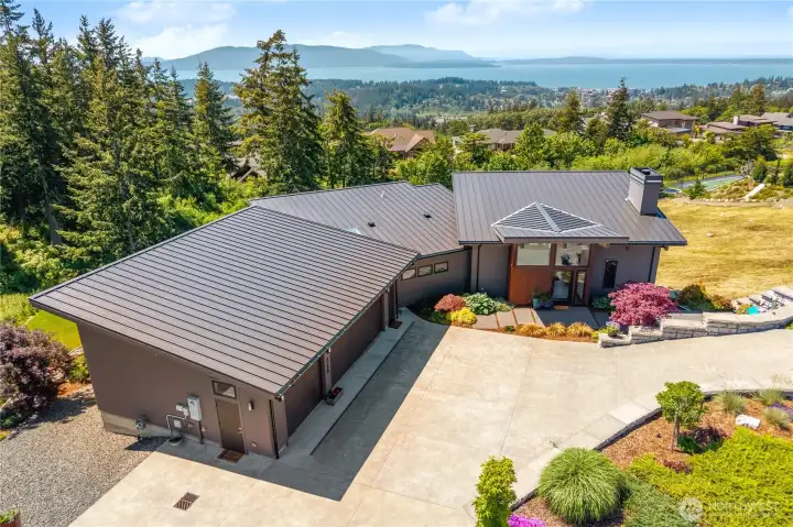 Large 3 car garage, wired for EV charger and plenty of driveway parking.