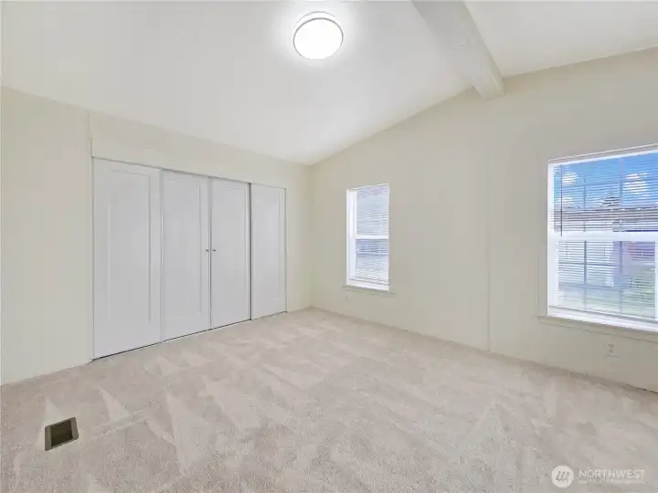 Spacious primary suite offering a peaceful retreat with plenty of room for your furniture and direct access to a private five-piece bath.
