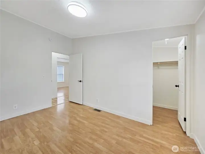 Secondary bedrooms are thoughtfully situated off the hallway, creating a functional split-bedroom design.