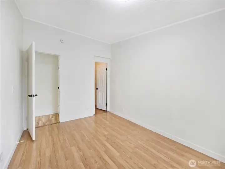 Spacious secondary bedroom featuring a walk-in closet for exceptional storage.