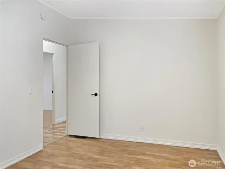 Spacious fourth bedroom with a walk-in closet, perfect for guests or a growing household.