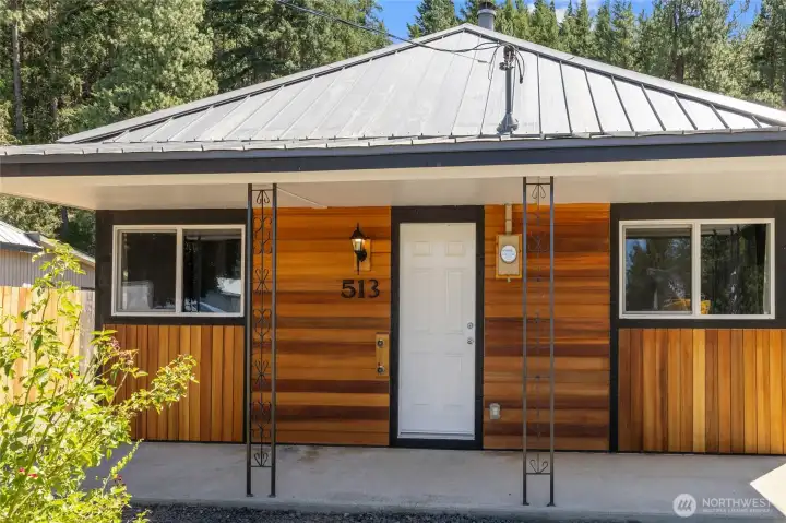 Covered Front Porch area features hot and cold spigots for easy maintenance or outside projects. Covered Front Porch area features hot and cold spigots for easy maintenance or outside projects.