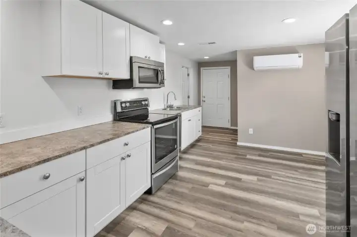 Plenty of counter space and cabinets in your brand new kitchen, also a new minisplit heatpump for whole house heating and cooling. Plenty of counter space and cabinets in your brand new kitchen, also a new minisplit heatpump for whole house heating and cooling.
