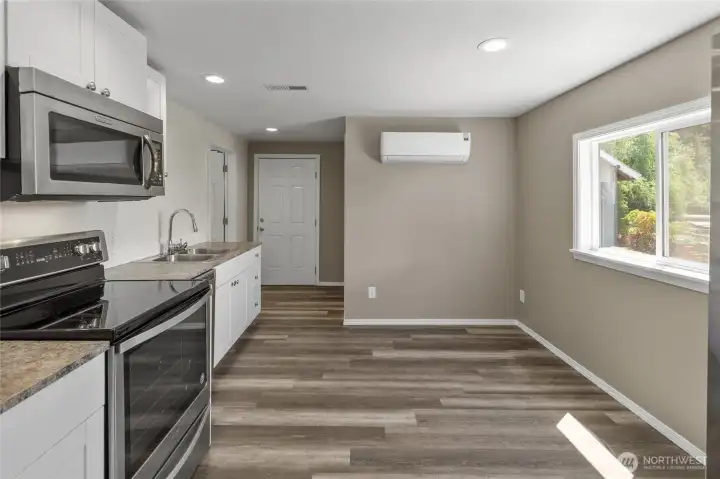 Kitchen plus a dining area, back door entrance shown too. Kitchen plus a dining area, back door entrance shown too.