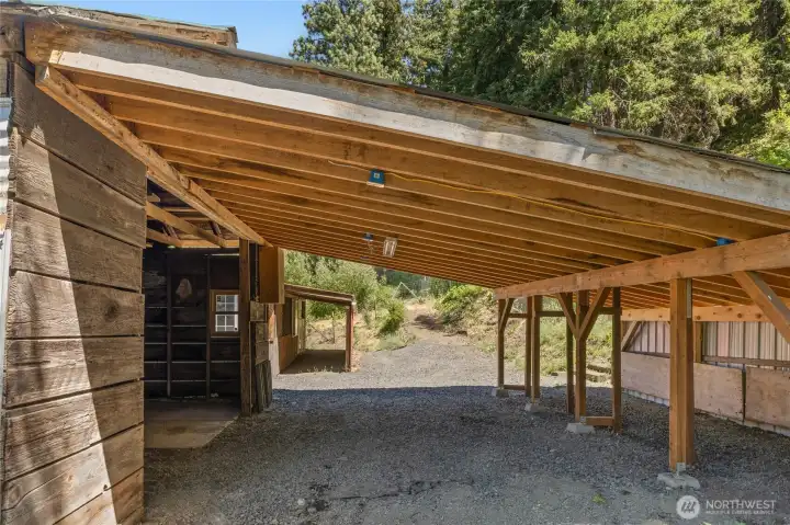 Covered Carport off the back of the garage, lighted and electrical. Plus an additional covered area off the back of the shop. Covered Carport off the back of the garage, lighted and electrical. Plus an additional covered area off the back of the shop.