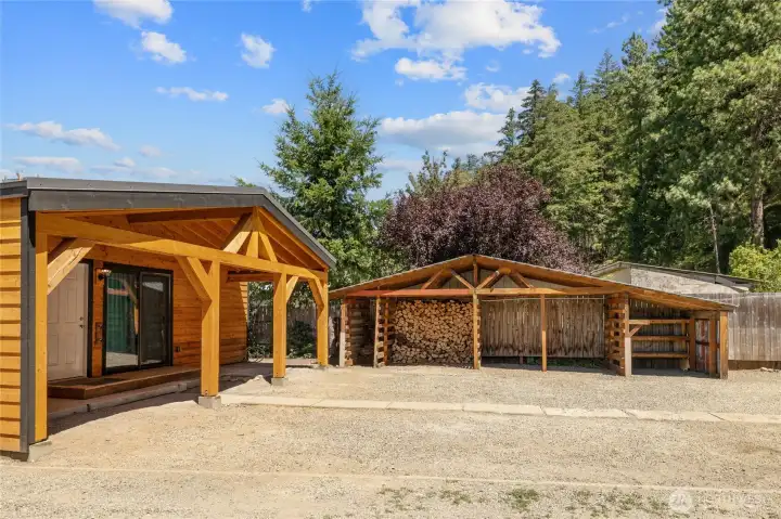 BEAUTIFUL custom beams covered back patio area and easy access to your massive wood storage building. BEAUTIFUL custom beams covered back patio area and easy access to your massive wood storage building.