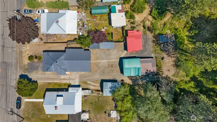 Overhead view of home and outbuildings, property goes up further too! Overhead view of home and outbuildings, property goes up further too!