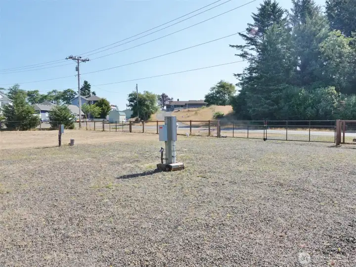 Large gravel RV pad w/ gated entry. Large gravel RV pad w/ gated entry.