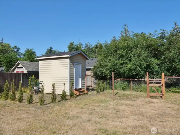 Shed w/ fenced garden area. Shed w/ fenced garden area.