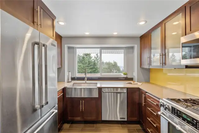 Stainless steel appliances and farm sink, with cherry cabinetry