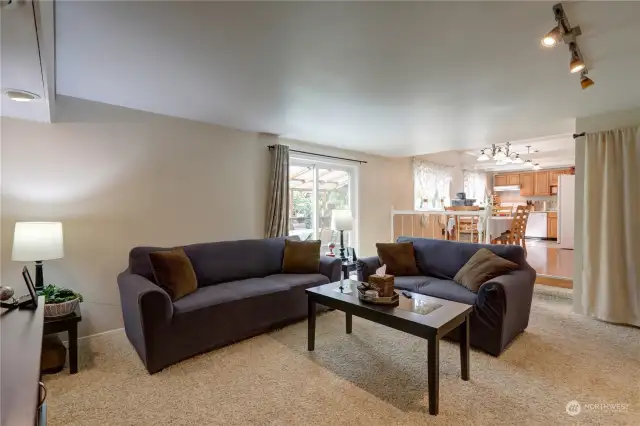 This extra room has been transformed into a spacious and inviting family room, perfect for gatherings and relaxation.