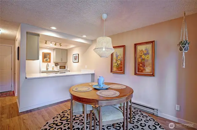 Cozy dining area with balcony access.
