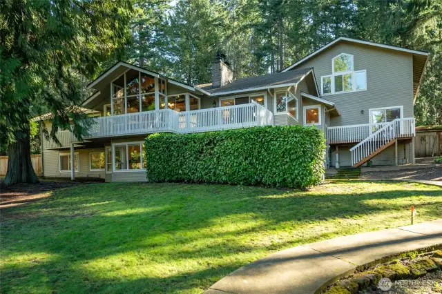 Grand NW Contemporary in Bridle Trails. Setting is nearly 1-full acre lot off cul-de-sac on a private lane.