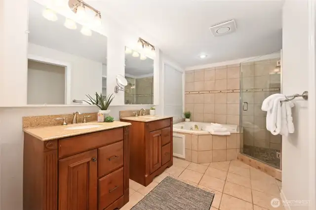 Dual sinks with separate tub and shower.