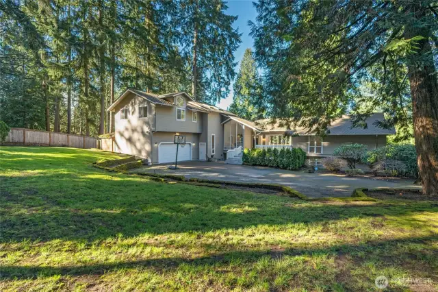 Storybook-like backyard is fully fenced.
