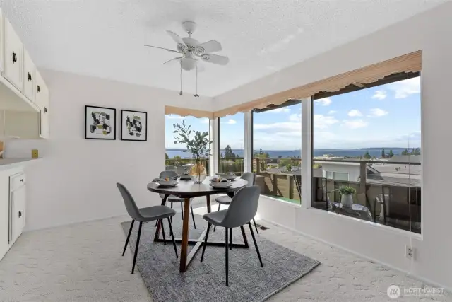 Formal dining area with a view! And a ceiling fan for those warm summer nights.
